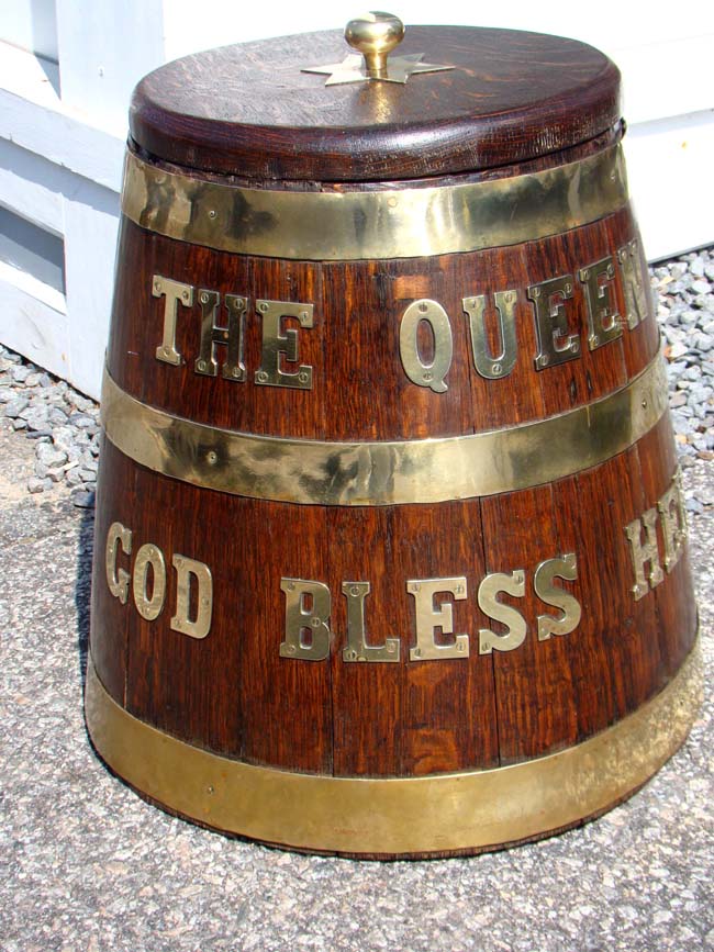 A fine Victorian Royal Navy brass bound oak rum barrell inscribed "The Queen, God Bless Her" circa 1860-1880.